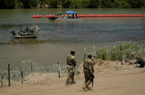 DOJ to sue Texas over floating border barrier; Abbott says ‘see you in court’